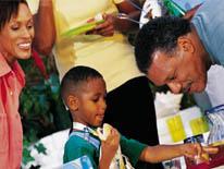 Foster Parents Two adults interacting with a child